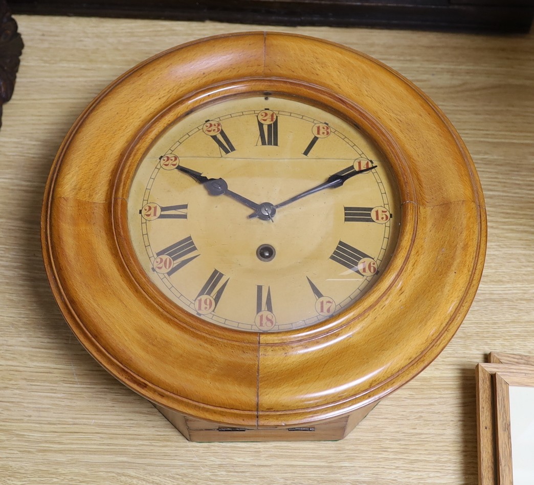A Black Forest beech dial wall clock, 34cms diameter